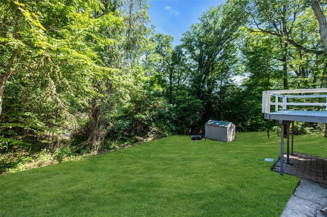 212 Sheldrake Ave, Port Jefferson, NY 11777 - view of grassy yard with a shed