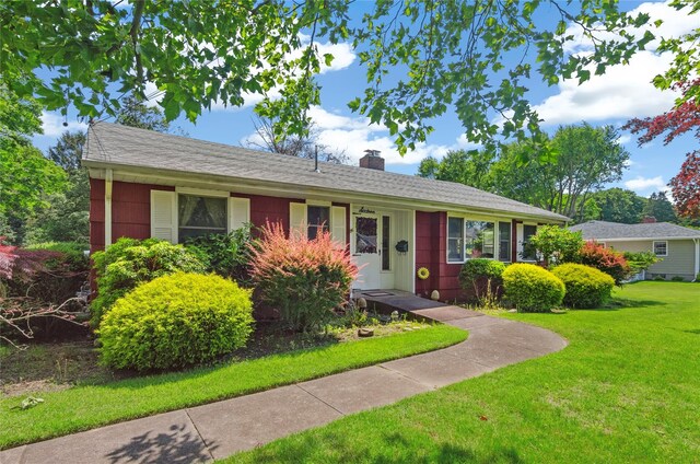 16 Colonial Dr, East Patchogue, NY 11772 - ranch-style home with a front yard and a chimney