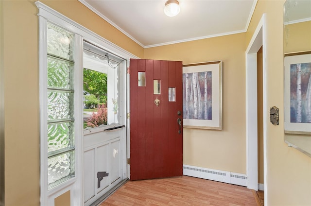 16 Colonial Dr, East Patchogue, NY 11772 - entrance foyer with a baseboard heating unit, crown molding, and light wood finished floors