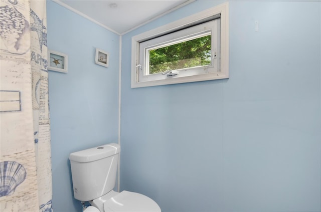 16 Colonial Dr, East Patchogue, NY 11772 - bathroom featuring toilet and ornamental molding