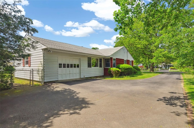 16 Colonial Dr, East Patchogue, NY 11772 - view of front of property with an attached garage, driveway, and a shingled roof