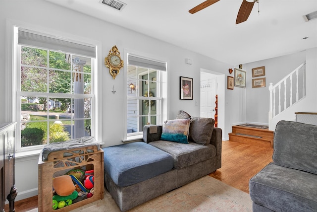 204 Watch Hill Dr, Tarrytown, NY 10591 - living area featuring ceiling fan, stairway, and wood finished floors