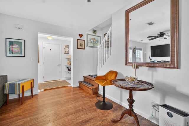 204 Watch Hill Dr, Tarrytown, NY 10591 - foyer entrance featuring stairs, wood finished floors, and a ceiling fan