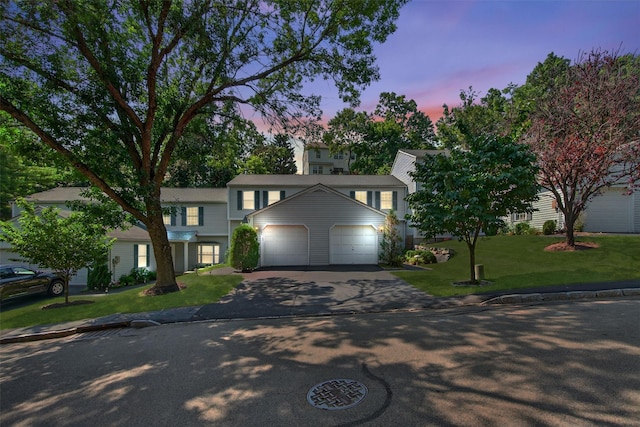 204 Watch Hill Dr, Tarrytown, NY 10591 - view of front of property featuring asphalt driveway, an attached garage, and a front lawn
