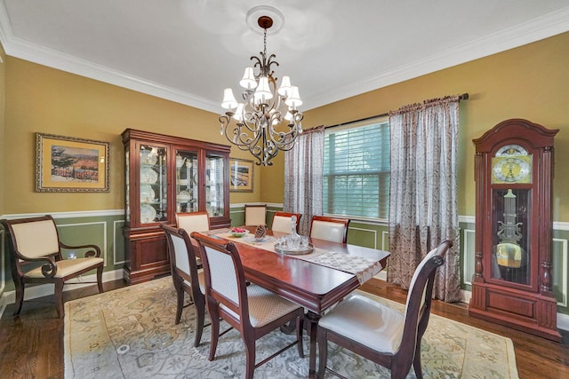 40 Independence Way, Miller Place, NY 11764 - dining space with a chandelier, wood finished floors, crown molding, wainscoting, and a decorative wall
