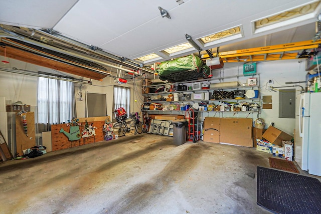 40 Independence Way, Miller Place, NY 11764 - garage with electric panel, freestanding refrigerator, and a garage door opener