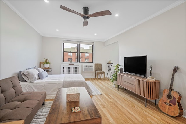 86-29 155th Ave Unit 5N, Howard Beach, NY 11414 - bedroom with light wood-type flooring, radiator heating unit, crown molding, recessed lighting, and an AC wall unit