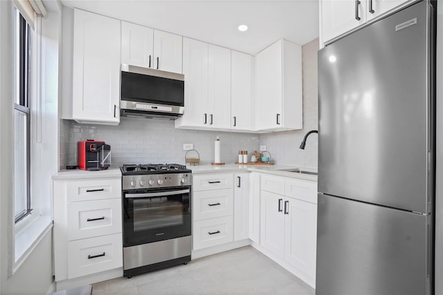 86-29 155th Ave Unit 5N, Howard Beach, NY 11414 - kitchen featuring stainless steel appliances, light countertops, light tile patterned floors, decorative backsplash, and recessed lighting