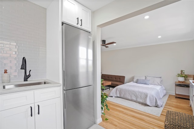 86-29 155th Ave Unit 5N, Howard Beach, NY 11414 - bedroom with stainless steel fridge, light wood finished floors, and recessed lighting
