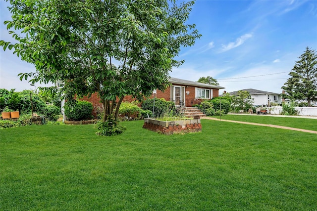 1541 Herzel Blvd, West Babylon, NY 11704 - view of front of home featuring a front yard and brick siding