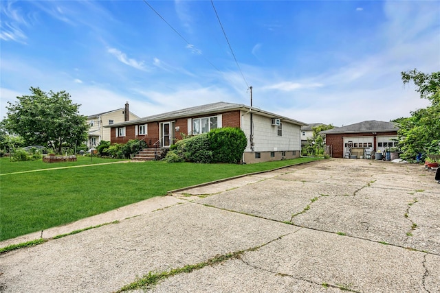 1541 Herzel Blvd, West Babylon, NY 11704 - view of front of property with brick siding, a front lawn, and a detached garage