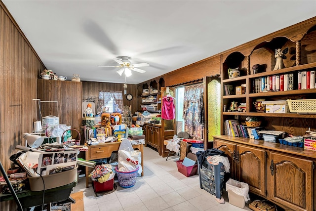 1541 Herzel Blvd, West Babylon, NY 11704 - home office with wood walls, a ceiling fan, and light tile patterned floors