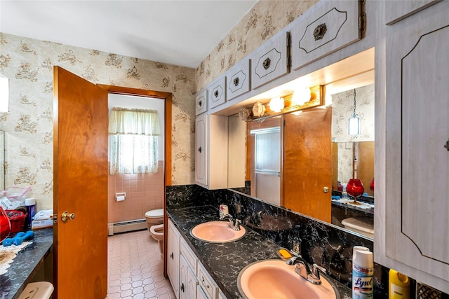 1541 Herzel Blvd, West Babylon, NY 11704 - full bathroom featuring a baseboard radiator, tile patterned flooring, wallpapered walls, double vanity, and a bidet