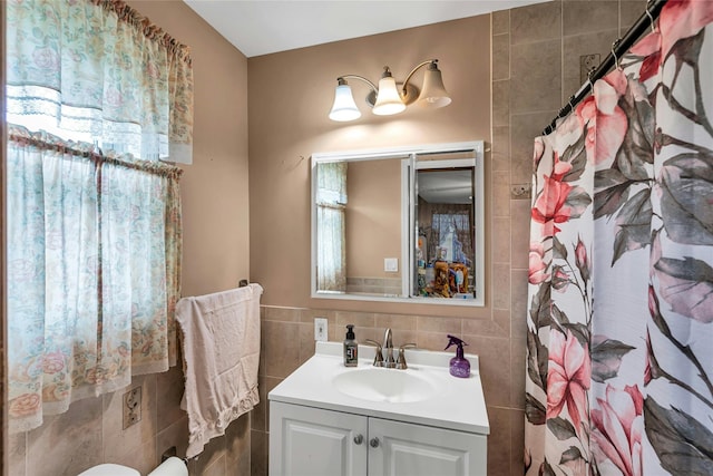 1541 Herzel Blvd, West Babylon, NY 11704 - bathroom featuring tile walls, vanity, and a shower with curtain