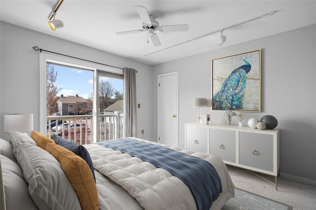 83 Hudson Point Ln, Ossining, NY 10562 - carpeted bedroom featuring track lighting, access to exterior, and ceiling fan