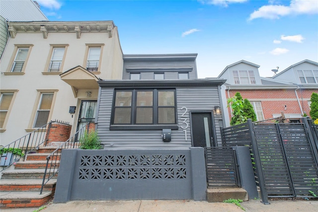 231 Macdougal St, Brooklyn, NY 11233 - view of front of house with a fenced front yard and a gate