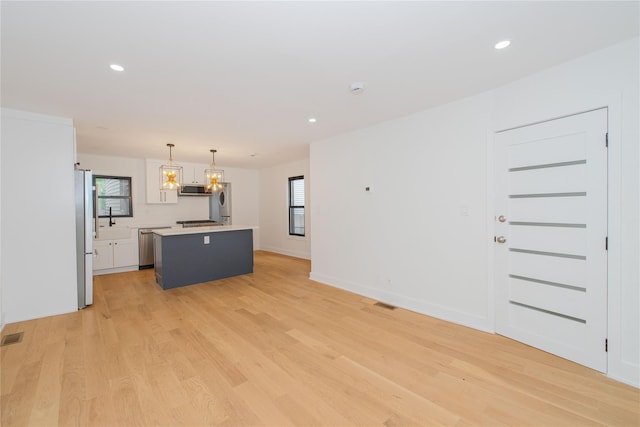 231 Macdougal St, Brooklyn, NY 11233 - unfurnished living room featuring light wood-style flooring and recessed lighting