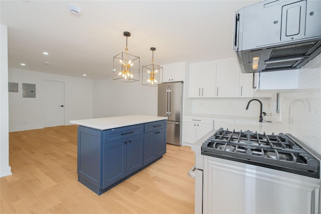 231 Macdougal St, Brooklyn, NY 11233 - kitchen featuring high end refrigerator, blue cabinets, light wood-style flooring, gas range oven, and recessed lighting