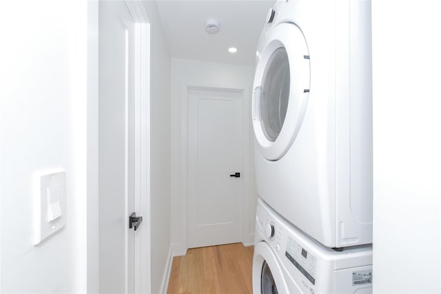 231 Macdougal St, Brooklyn, NY 11233 - laundry room with stacked washer / drying machine, light wood-style flooring, and recessed lighting