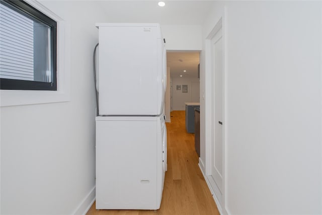 231 Macdougal St, Brooklyn, NY 11233 - hall with stacked washer / drying machine, light wood finished floors, and recessed lighting