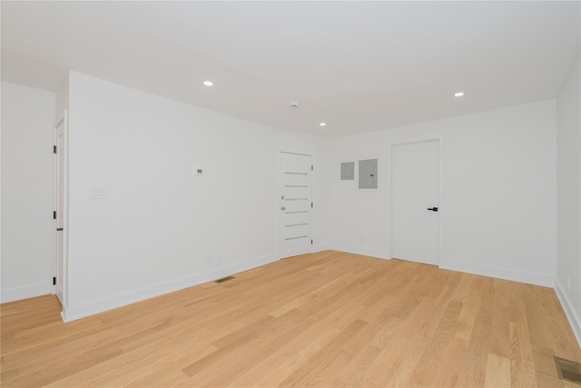 231 Macdougal St, Brooklyn, NY 11233 - empty room with light wood finished floors, recessed lighting, and electric panel