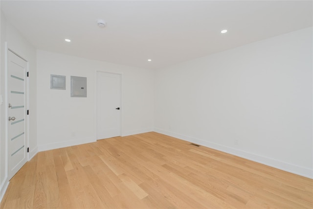 231 Macdougal St, Brooklyn, NY 11233 - unfurnished room featuring electric panel, light wood finished floors, a smoke detector, and recessed lighting