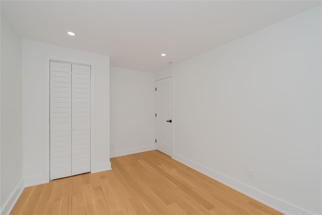 231 Macdougal St, Brooklyn, NY 11233 - unfurnished bedroom featuring light wood-style flooring, recessed lighting, and a closet