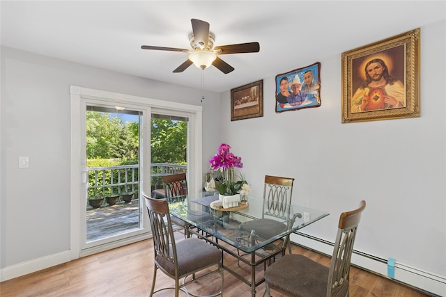 2 Prospect St, Central Islip, NY 11722 - dining room featuring a ceiling fan, baseboard heating, and light wood-type flooring