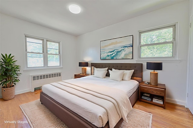 150-01 Horace Harding Expy, Flushing, NY 11367 - bedroom featuring radiator heating unit and light wood-type flooring