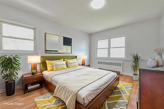 150-01 Horace Harding Expy, Flushing, NY 11367 - bedroom with radiator heating unit and light wood-type flooring