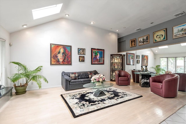 895 Cherry Ln, North Woodmere, NY 11581 - living area with a skylight, wood finished floors, high vaulted ceiling, and recessed lighting