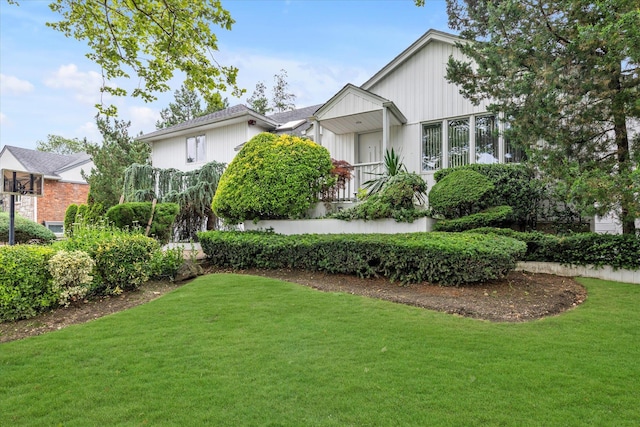 895 Cherry Ln, North Woodmere, NY 11581 - view of front of property with a front lawn