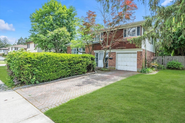 17 Edna Dr, Syosset, NY 11791 - view of front of house featuring brick siding, an attached garage, and driveway