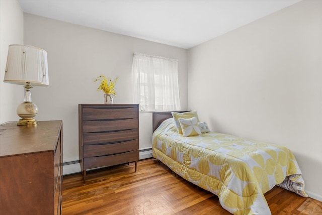 17 Edna Dr, Syosset, NY 11791 - bedroom with baseboard heating and wood finished floors