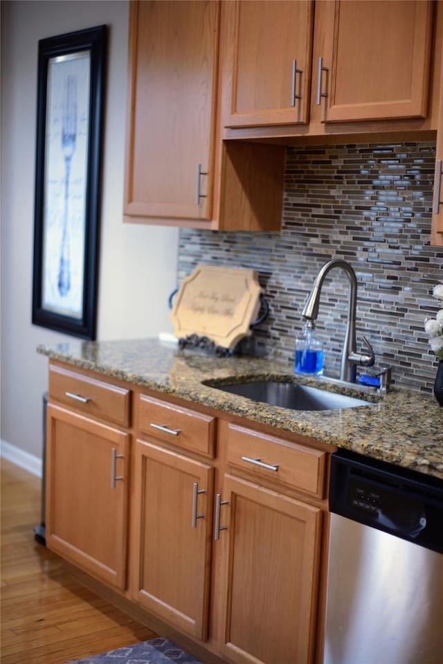 15 Cobblestone Ln, Middletown, NY 10940 - kitchen featuring stainless steel dishwasher, tasteful backsplash, light wood-style floors, and light stone countertops