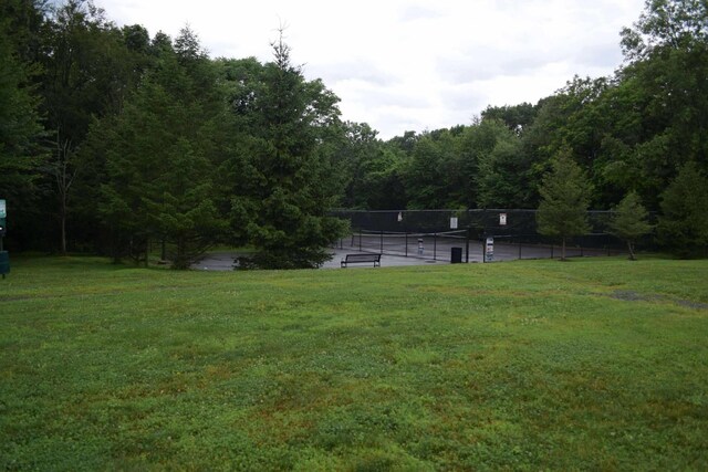 15 Cobblestone Ln, Middletown, NY 10940 - view of yard featuring a tennis court and a view of trees