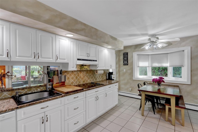 25 Lloyd Ln, Nesconset, NY 11767 - kitchen featuring under cabinet range hood, black electric cooktop, dishwasher, decorative backsplash, and dark stone countertops