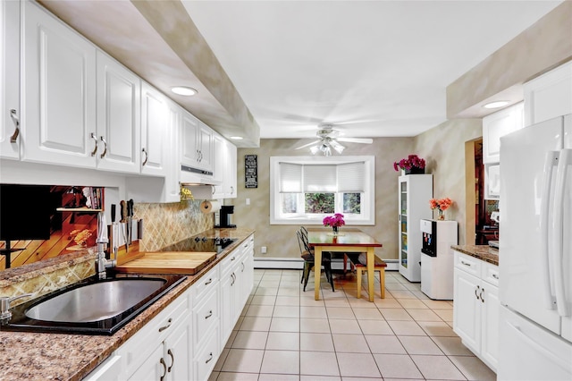 25 Lloyd Ln, Nesconset, NY 11767 - kitchen featuring freestanding refrigerator, under cabinet range hood, a ceiling fan, light tile patterned flooring, and white cabinetry