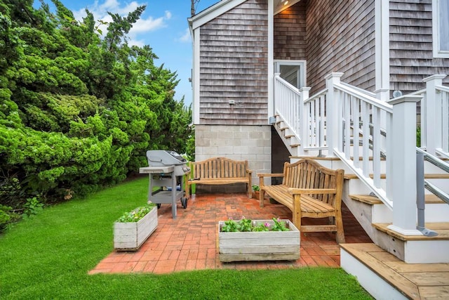 15 Bayside Ave, East Quogue, NY 11942 - deck featuring a patio, grilling area, a lawn, stairs, and an outdoor hangout area