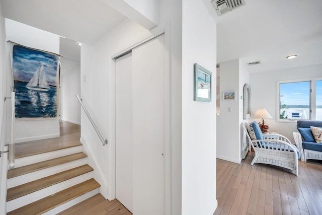15 Bayside Ave, East Quogue, NY 11942 - stairway with hardwood / wood-style flooring and baseboards