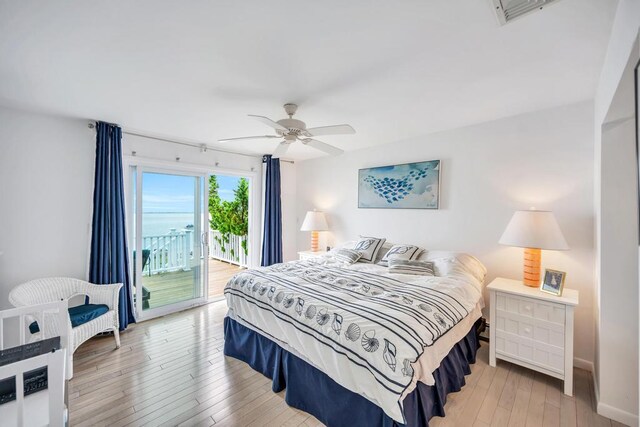 15 Bayside Ave, East Quogue, NY 11942 - bedroom featuring access to exterior, light wood-type flooring, and a ceiling fan