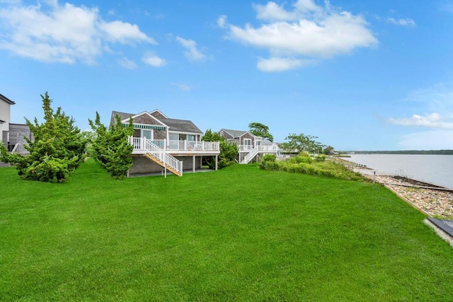 15 Bayside Ave, East Quogue, NY 11942 - view of grassy yard with stairs and a deck with water view