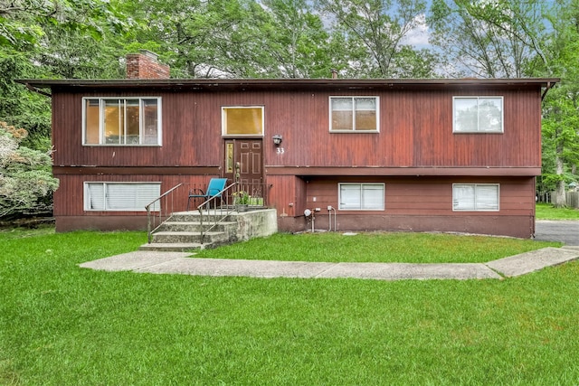 33 Balmoral Dr, Chestnut Ridge, NY 10977 - view of front of house with a chimney and a front lawn