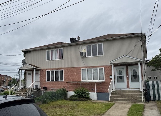 146-66 222nd St, Springfield Gardens, NY 11413 - townhome / multi-family property featuring brick siding and entry steps