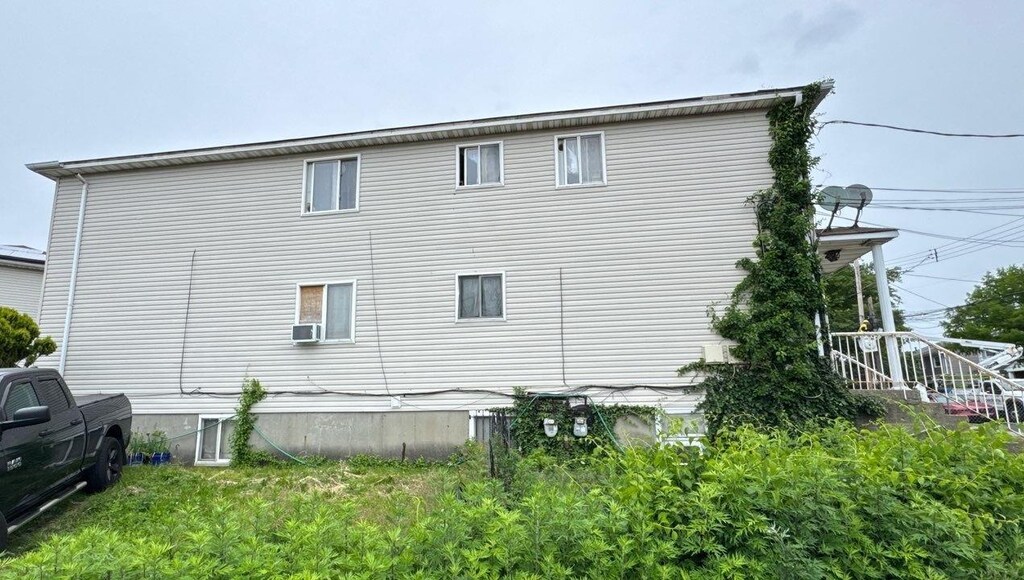 146-66 222nd St, Springfield Gardens, NY 11413 - view of side of home with cooling unit