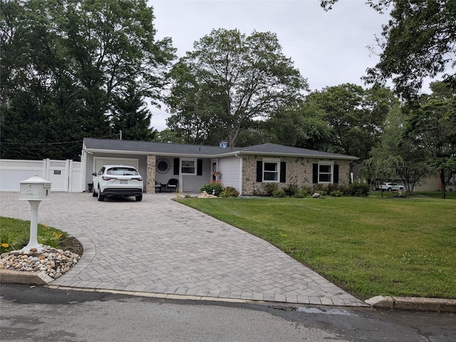 9 Songsparrow Ln, Centereach, NY 11720 - ranch-style house featuring an attached garage, decorative driveway, and stone siding