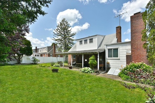 136 Euclid Ave, Massapequa, NY 11758 - rear view of house with a chimney