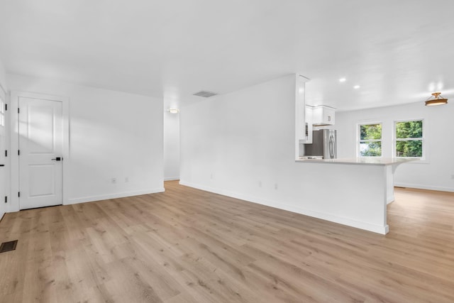 50 Appletree Dr, Saugerties, NY 12477 - unfurnished living room featuring light wood finished floors and baseboards