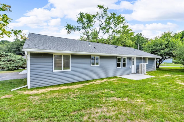 50 Appletree Dr, Saugerties, NY 12477 - rear view of property featuring a lawn, a shingled roof, and a patio area