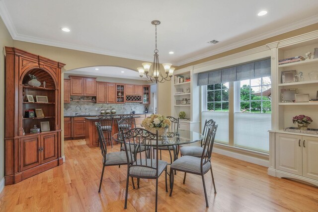 28 Hamlet Dr, Commack, NY 11725 - dining room featuring a chandelier, light wood finished floors, ornamental molding, and recessed lighting